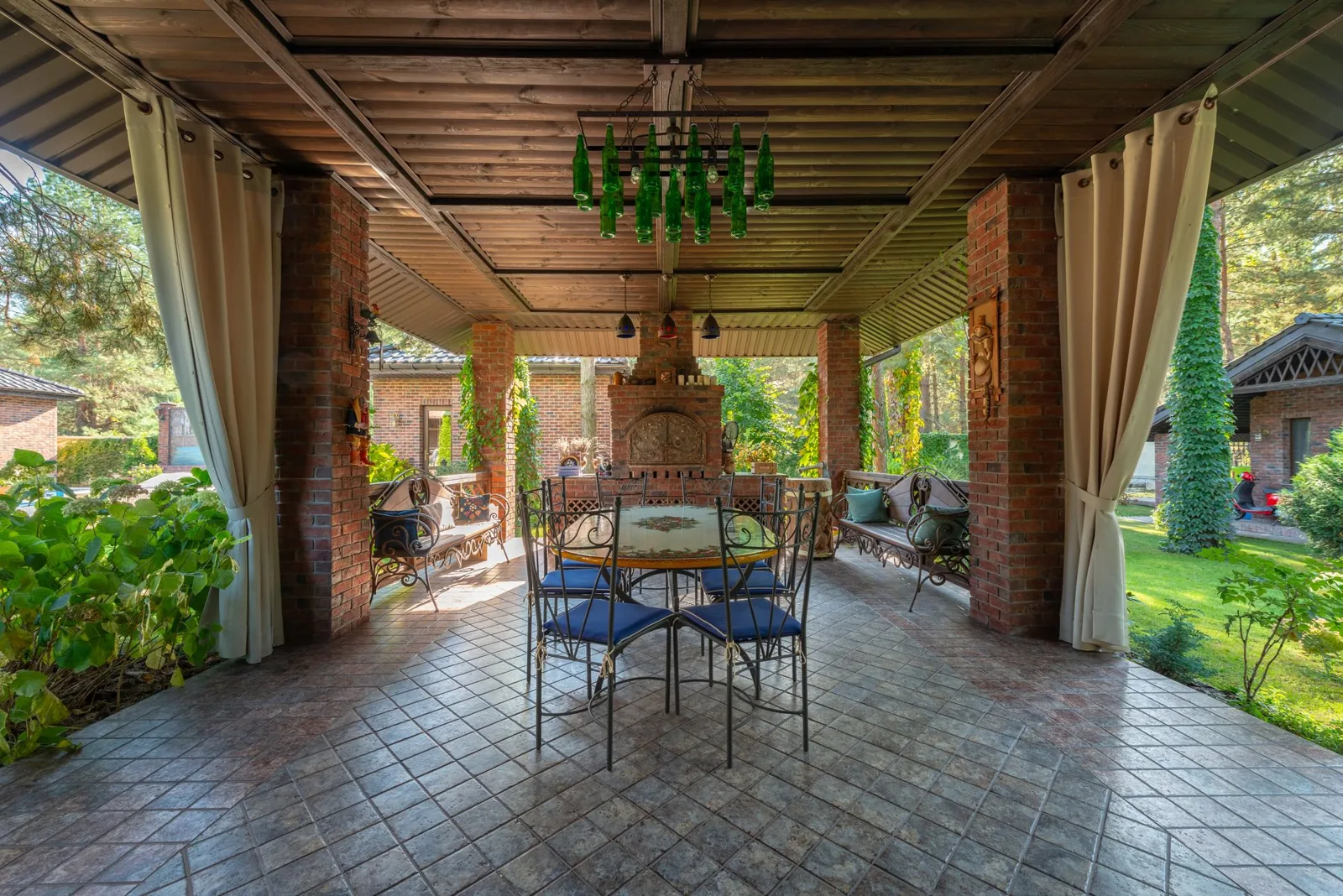 Retractable awning extending over an outdoor dining area on a sunny afternoon